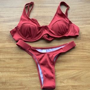 Raspberry ribbed bathing suit.